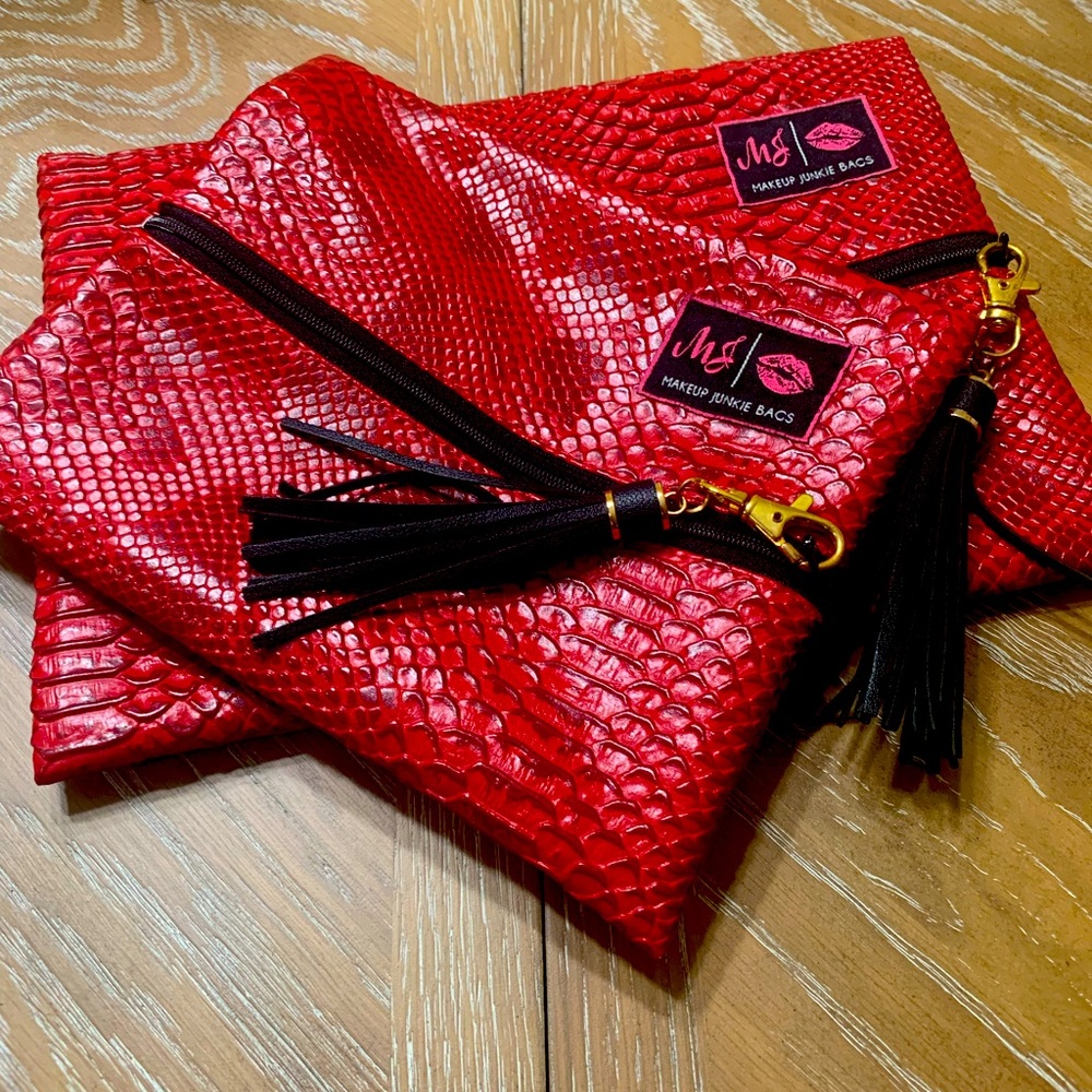 Makeup junkies snake print bags! A beautiful red.